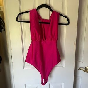 Pink low cut body suit